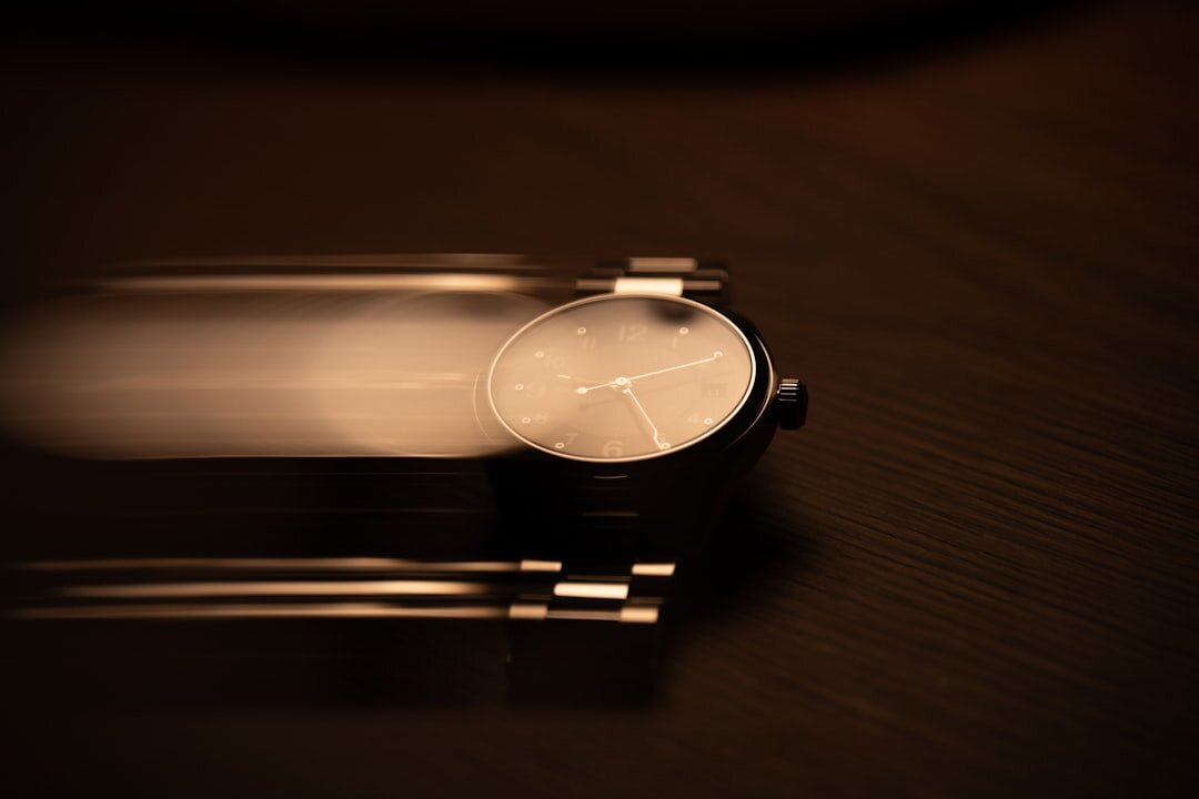 Luxury gold chronograph wristwatch on a dark surface