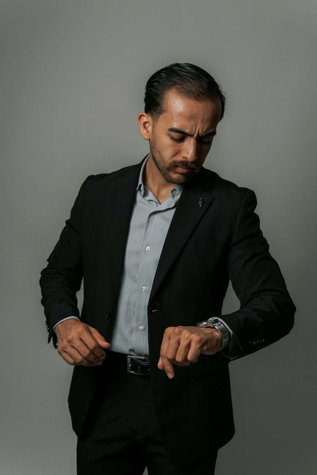 Studio portrait of a professional hispanic man in a tailored suit
