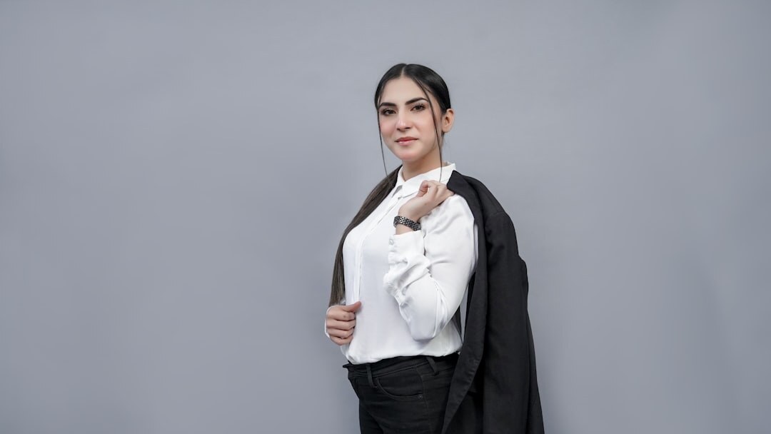 Studio portrait of a professional hispanic woman in elegant business attire